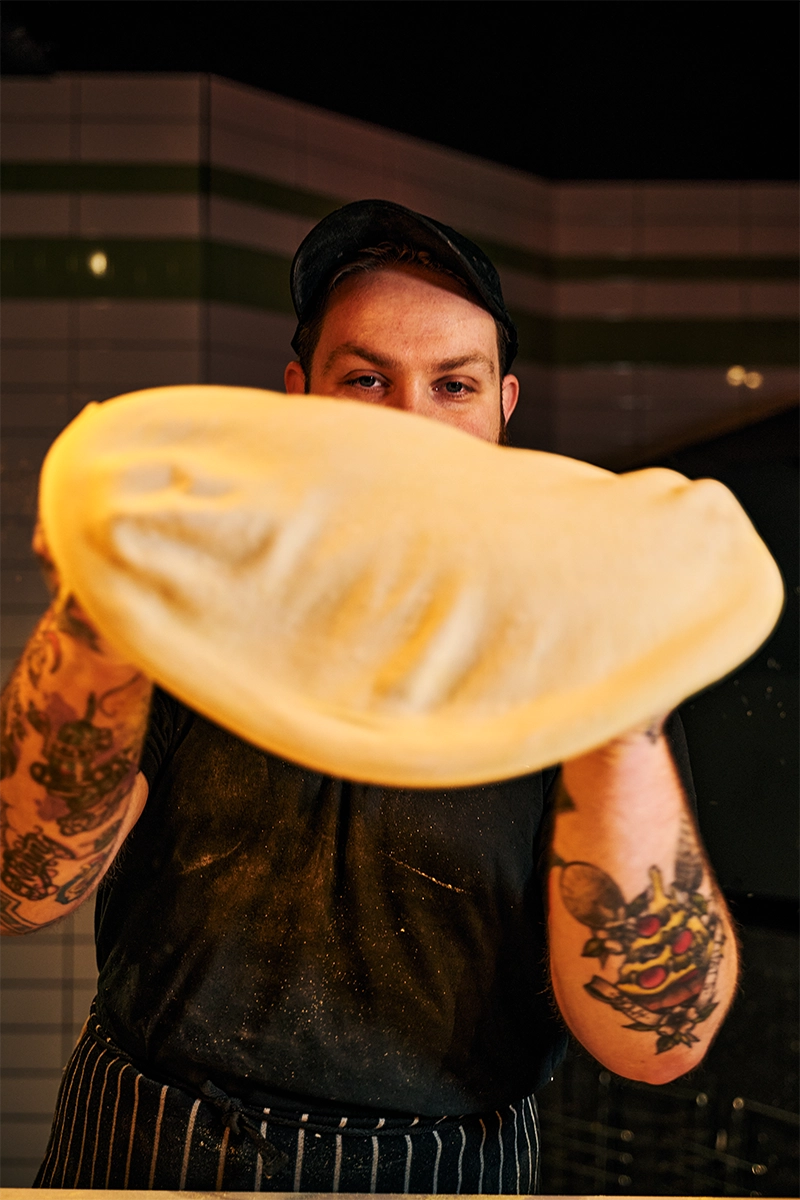 A blistered, double-fermented sourdough pizza base